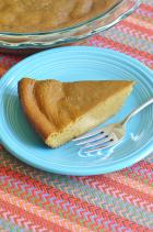 Phot of served pumpkin pie slice
