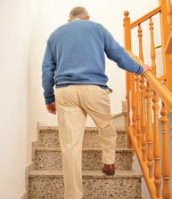 older man climbing stairs