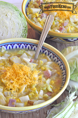 Small bowls of potato and ham soup with shredded cheese.