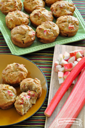 Platter of muffins with small pink rhubarb pieces.