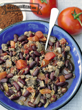 Small bowl of chili with beans, ground meat and vegetables.