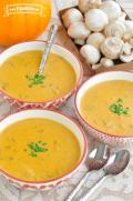 Bowls of pumpkin mushroom soup garnished with chives.