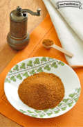 Small bowl of a red spice mix.