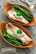 plates of Microwave Steamed Fish with colorful vegetable sides.