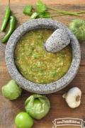 Bowl of green textured salsa.