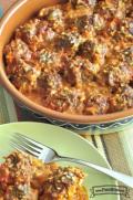 Baking dish of meatballs in a creamy sauce.