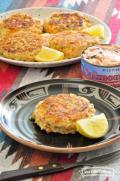 Plate of golden Salmon Patties with lemon slices.