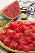 Plate of seasoned watermelon chunks.