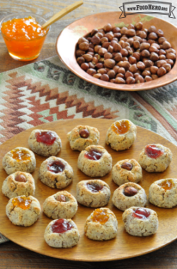 Plate of bite-sized cookies with a gooey jam center.
